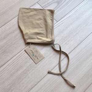 The Simple Folk pixie hat in camel 7-10 years